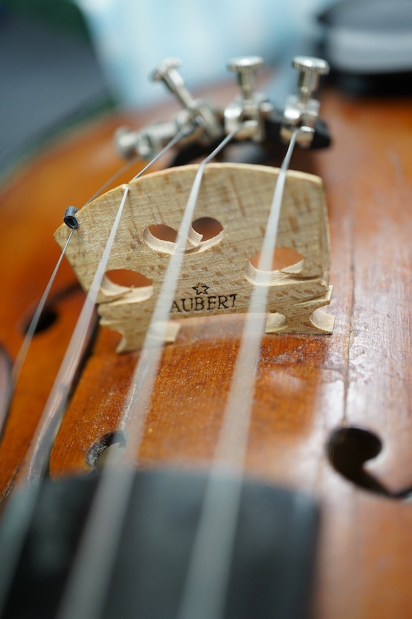 Three violins; a 3/4 Czech, a 1/2 size German and a 1/4 size Czech, all cased. Condition - fair to good